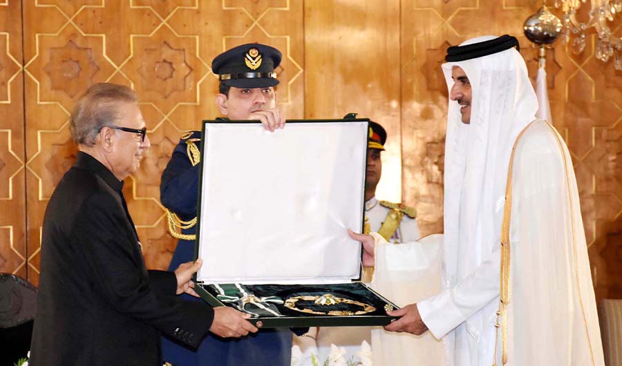 Pakistan’s President Arif Alvi confers Pakistan’s highest civilian honor, the Nishan-e-Pakistan (Order of Pakistan), on Qatar’s emir Tamim bin Hammad Al Thani during a ceremony held at the President House in Islamabad on June 23, 2019. (PID)