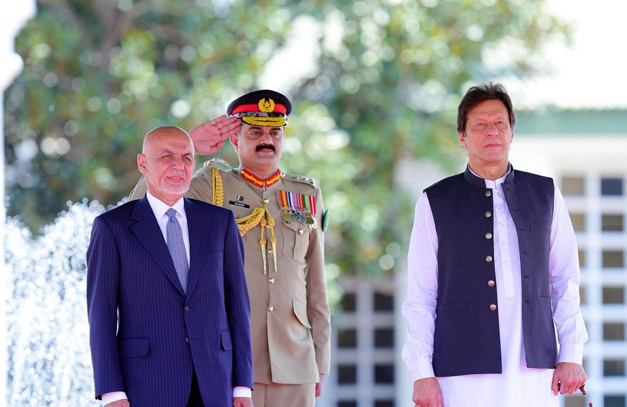 Pakistan's prime minister Imran Khan and Afghan president Ashraf Ghani can be seen together during the Guard of Honor ceremony in Islamabad on 27th June, 2019. (PID)