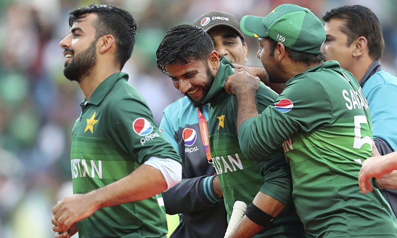 Pakistani players celebrate with teammate all-rounder Imad Wasim whose unbeaten 49 guided Pakistan to a thrilling three-wicket victory over Afghanistan in Leeds on Saturday, June 29, 2019 (AP)