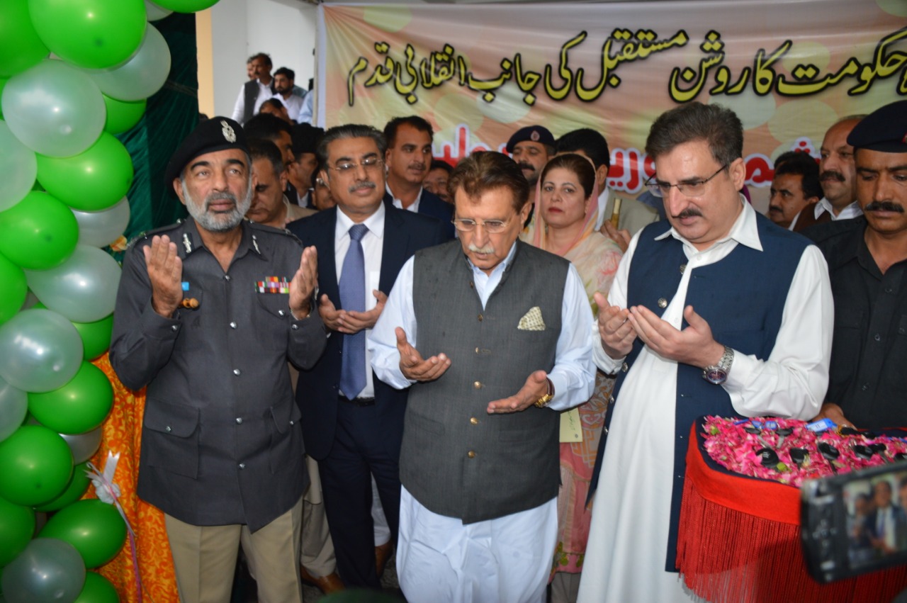 From left, Inspector General of Police (IGP) Salahuddin Khan, AJK Prime Minister Raja Farooq Haider and Minister for Communication and Tourism Mushtaq Minhas say a prayer at the inauguration of the tourism police in Muzaffarabad, capital of Azad Jammu and Kashmir on June 24, 2019. (Credit: Police Media Center AJK)