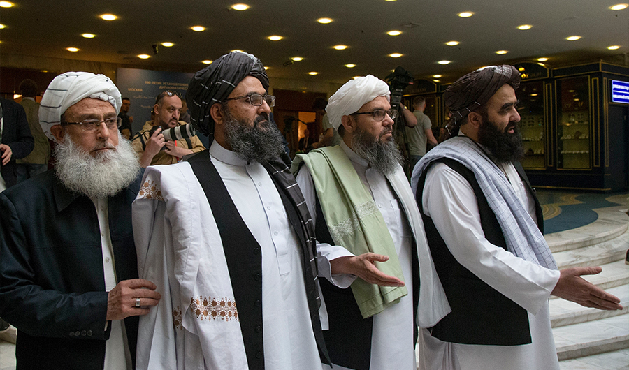 FILE - In this file photo taken on Tuesday, May 28, 2019, Mullah Abdul Ghani Baradar, the Taliban group's top political leader, second from left, arrives with other members of the Taliban delegation for talks in Moscow, Russia. (AP Photo/File)