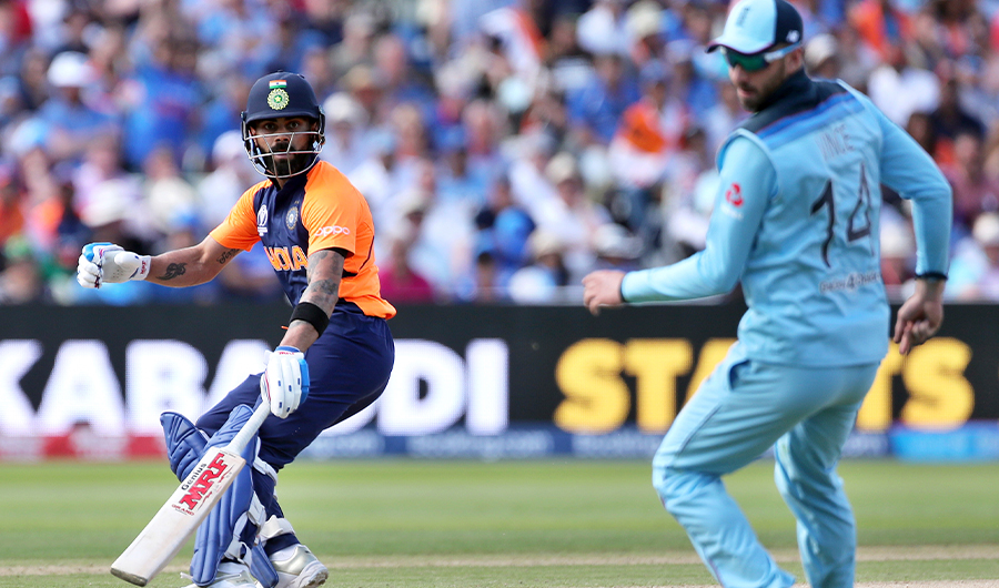India's captain Virat Kohli, left, watches the ball after playing a shot during the Cricket World Cup match between England and India at Edgbaston in Birmingham, England, Sunday, June 30, 2019. (AP)