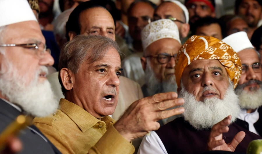 Shehbaz Sharif, second from left, the PML-N president and brother of Nawaz Sharif, speaks during a news conference as Fazal ur Rehm Jamiat Ulma-e-Islam party leader looks on after an All Parties Conference in Islamabad on July 27, 2018. (Reuters/File)