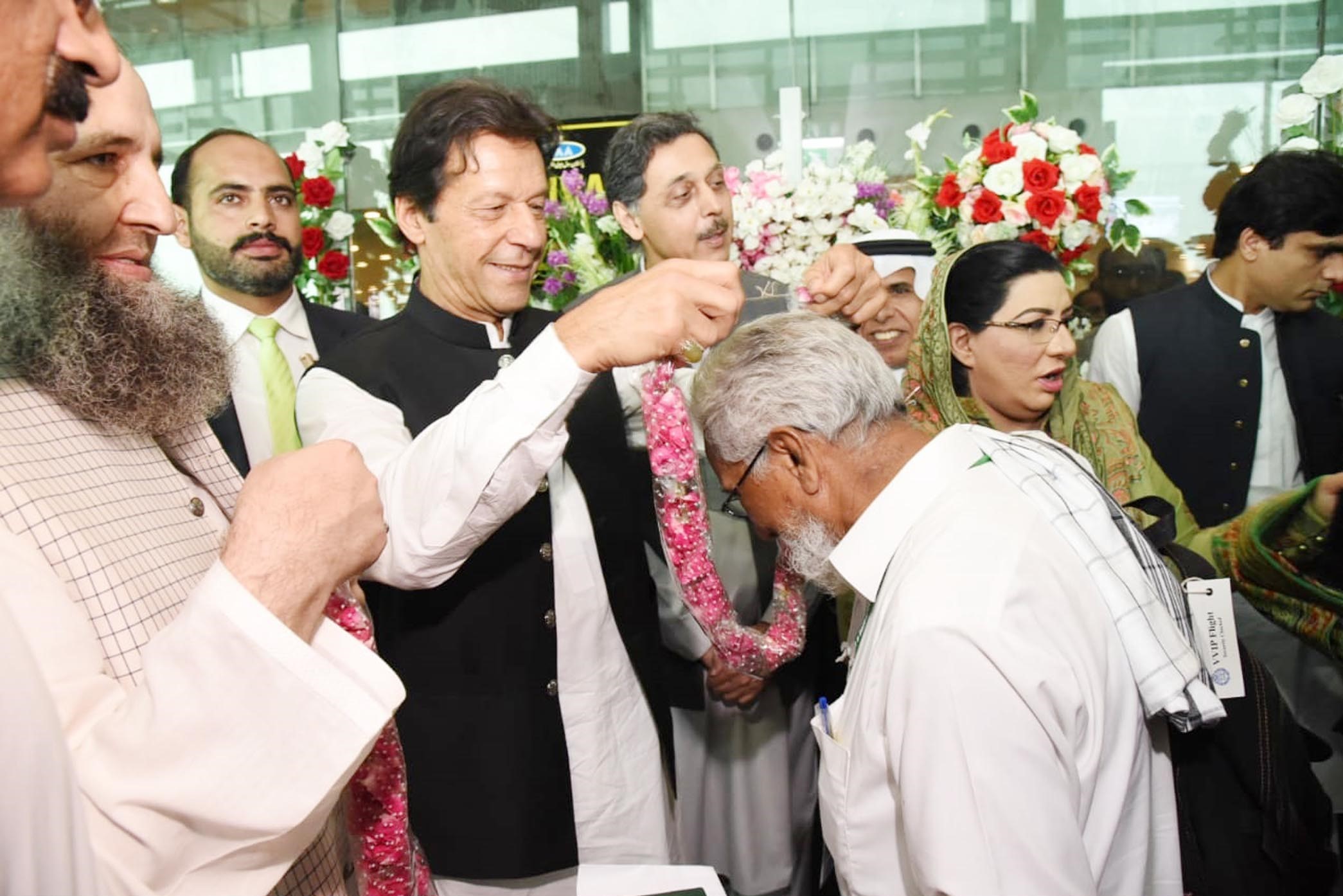 Prime Minister Imran Khan seeing off Hajj pilgrims after inaugurating the “Road to Makkah” program at Islamabad International Airport on 5th July, 2019. (PID)