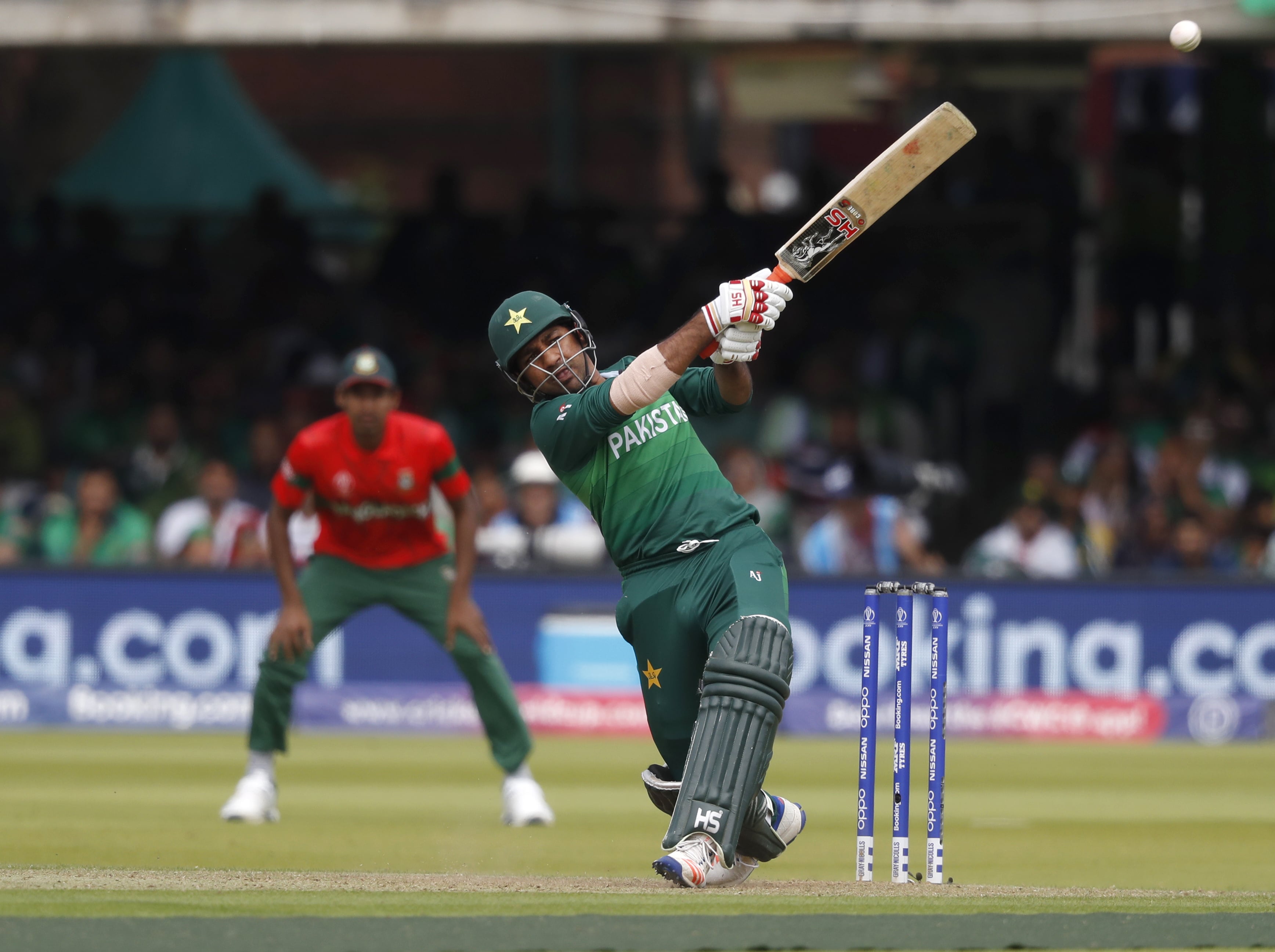 Pakistan's captain Sarfaraz Ahmed hits 4 runs off the bowling of Bangladesh's Mohammad Saifuddin during the Cricket World Cup match between Pakistan and Bangladesh at Lord's cricket ground in London, Friday, July 5, 2019. (AP)
