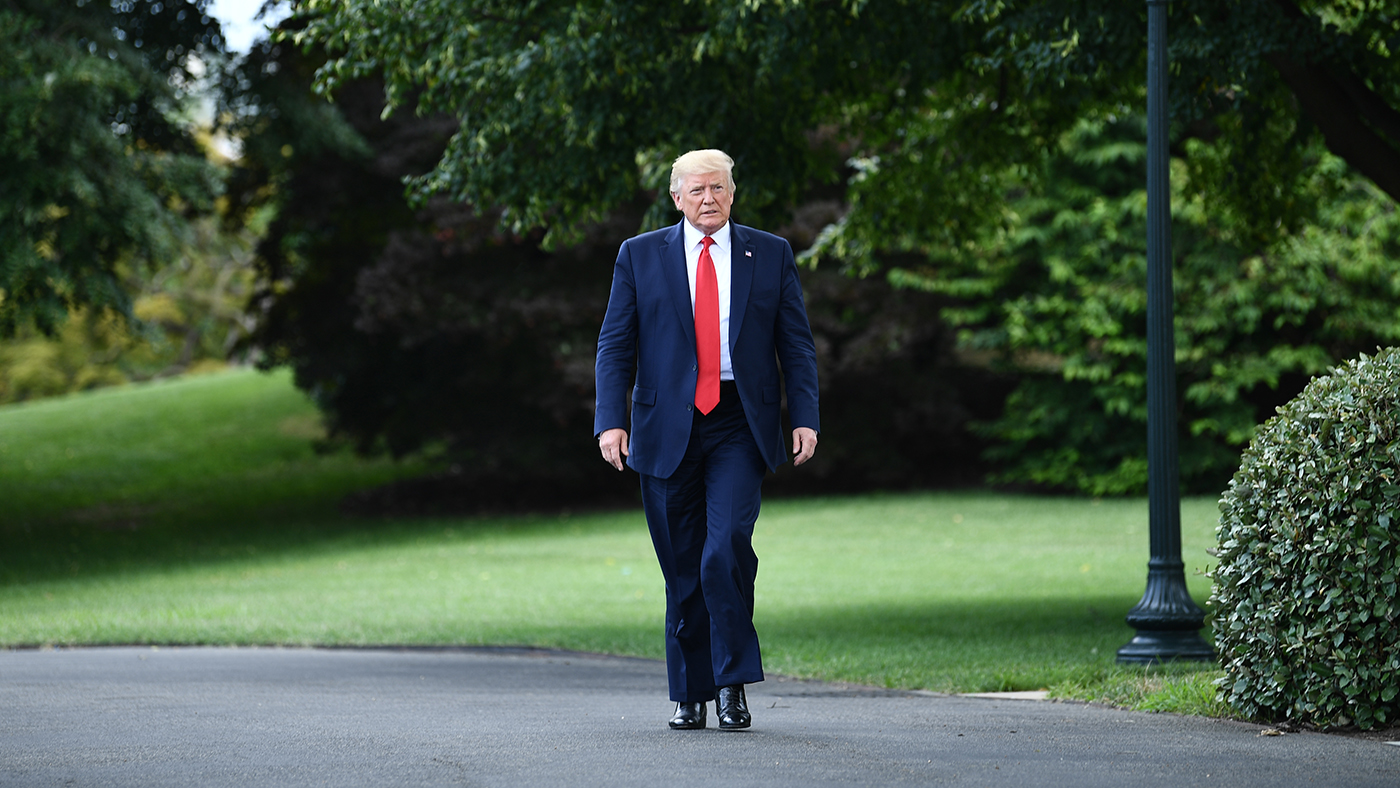 US President Donald Trump arrives to speak to the press as he departs the White House in Washington, DC, on July 17, 2019. (AFP)