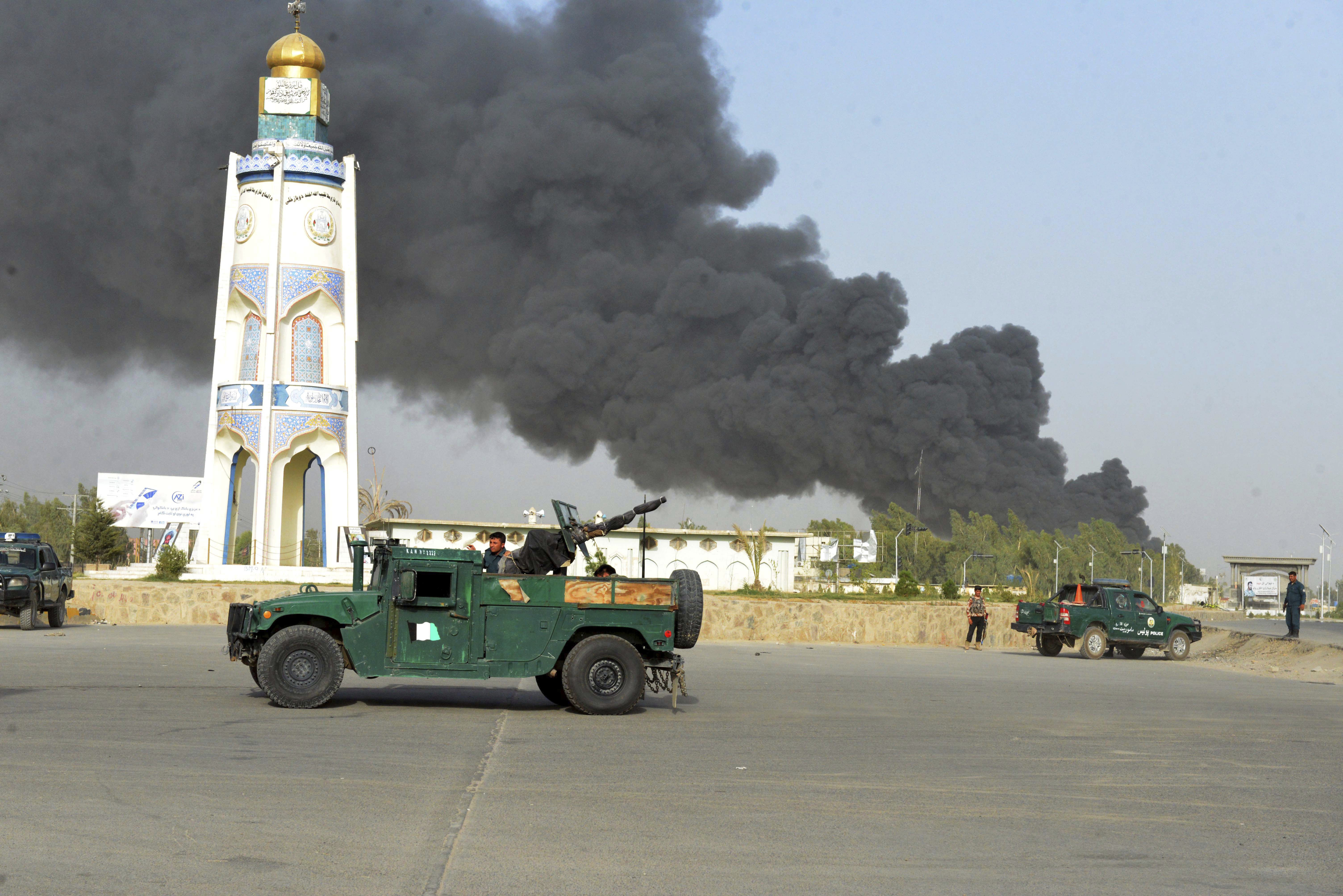 Afghan security forces arrive after a powerful explosion outside the provincial police headquarters in Kandahar province south of Kabul, Afghanistan, Thursday, July 18, 2019. A Taliban fighter in southern Kandahar province attacked the police headquarters with a car bomb, killing himself and at least nine others and wounding dozens more, officials said. (AP)