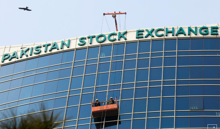 Workers clean a glass facade of the Pakistan Stock Exchange (PSX) building in Islamabad, Pakistan December 3, 2018. REUTERS/Faisal Mahmood