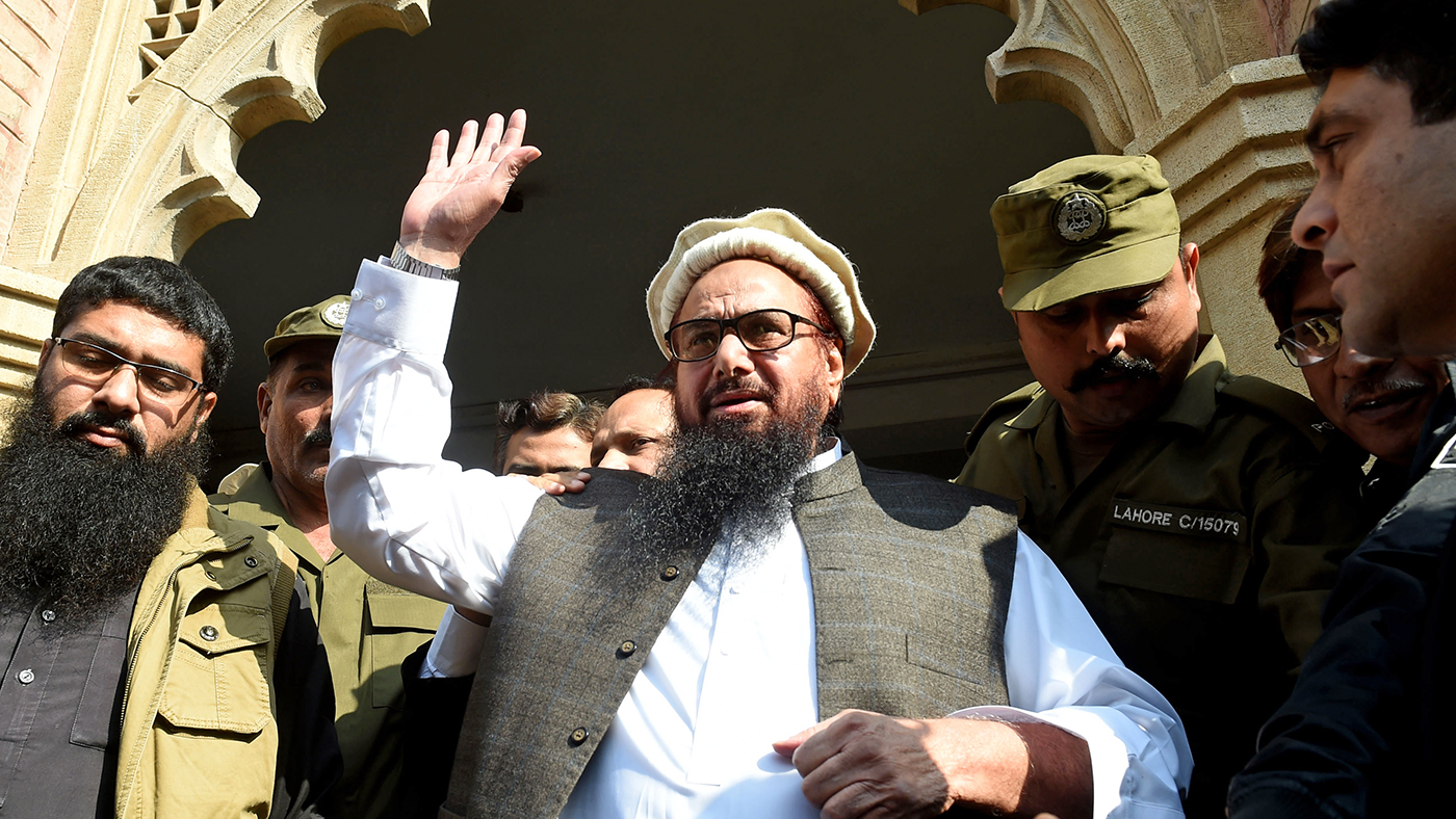 In this file photo, Pakistan head of the Jamaat-ud-Dawa (JuD) organisation Hafiz Saeed waves to supporters as he leaves a court in Lahore on Nov. 21, 2017. (AFP)
