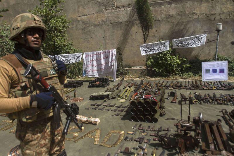 In this July 9, 2014 file photo, a Pakistani soldier stands by ammunition seized during a military operation against Taliban militants, in the of town of Miranshah, North Waziristan. (Reuters)