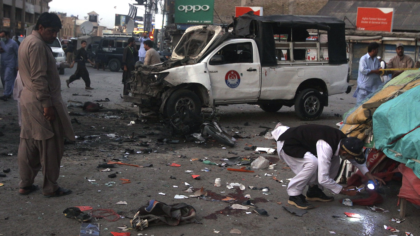 Officials collect evidence at the site of bombing in Quetta, Pakistan, July 30, 2019. (AP)