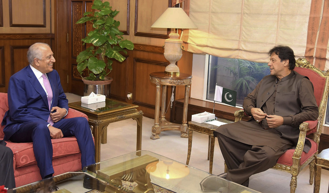 In this photo released by the Press Information Department, Pakistan’s Prime Minister Imran Khan, right, meets US envoy Zalmay Khalilzad in Islamabad, Pakistan, Thursday, Aug. 1, 2019. (Press Information Department, via AP)
