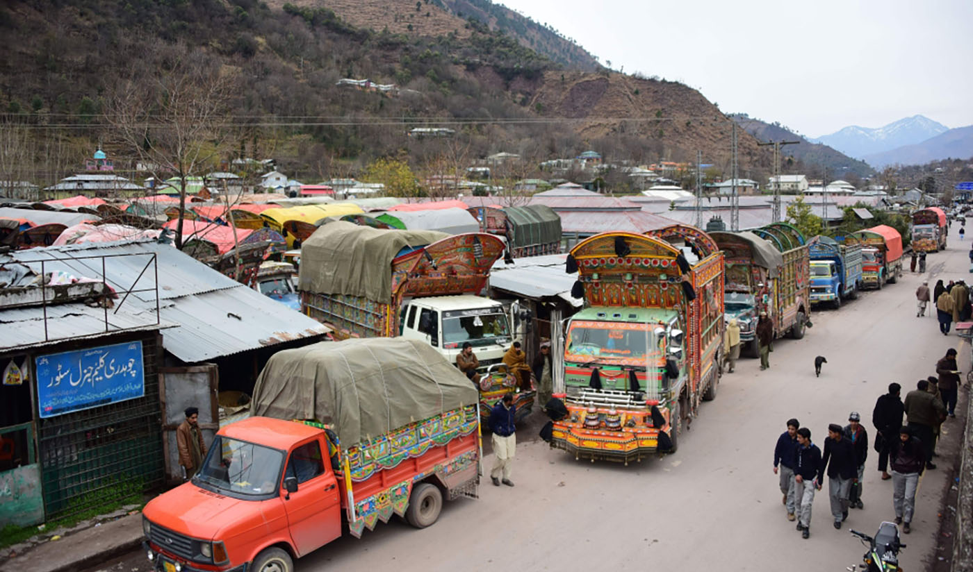 Goods trucks at the border town of Chakothi in Azad Kashmir, some 3 km from Line of Control on Feb 20, 2019. Following the Pulwama attack, India revoked MFN status to Pakistan and slammed 200 per cent import duty on imports. (AFP/File)