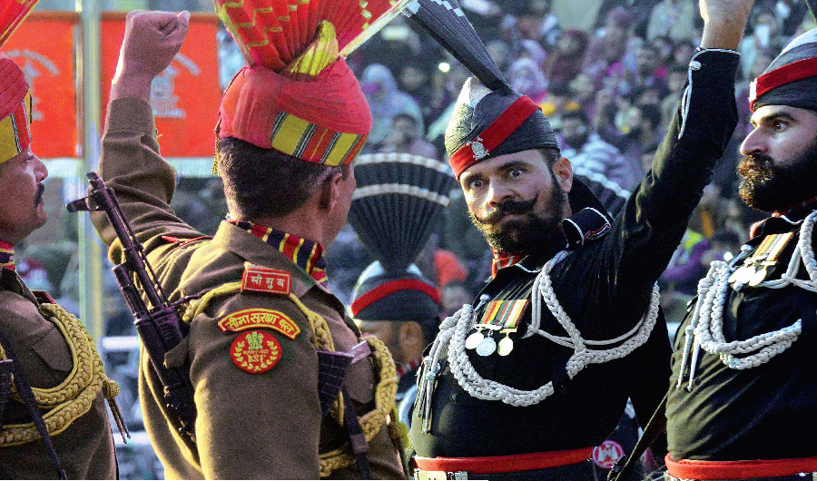 Indian Border Security Force (BSF) personnel (in brown) and Pakistani rangers (in black) take part in the Beating Retreat ceremony at the Wagah border on January 26, 2019. ( AFP/ File )