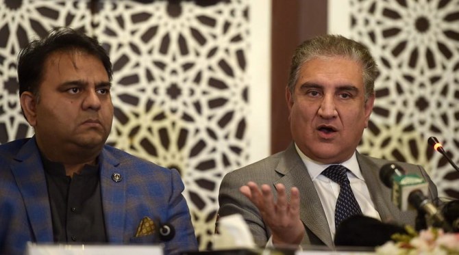 Shah Mehmood Qureshi, right, said he knows the implications that come with him making such statements. (AFP/File)