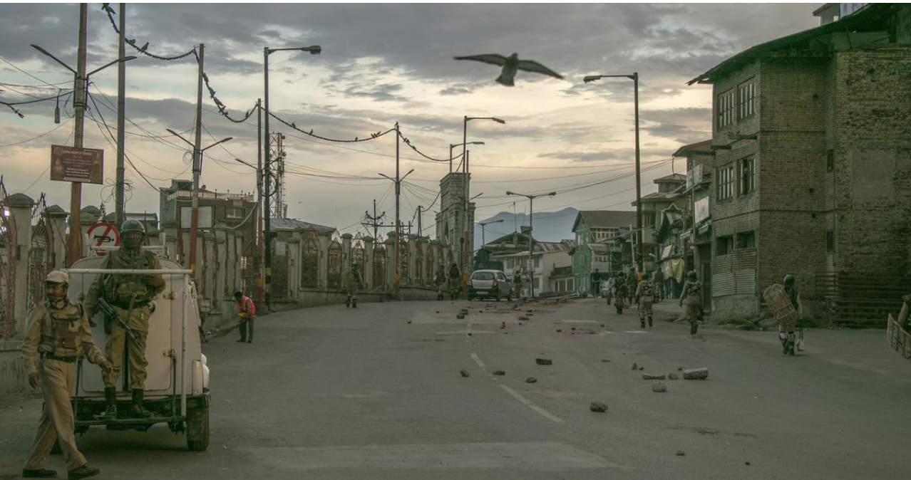 Indian security forces personnel walk on a street in Srinagar on Friday August 09,2019 amid widespread restrictions on movement and a telecommunications blackout. (Photo credit: AFP)