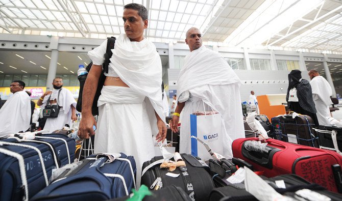 Muslim pilgrims arrive at Jeddah airport in the Saudi capital on July 14,2018. (AFP)