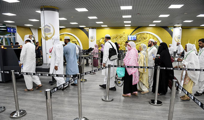 Pakistani pilgrims breeze through immigration counters at Prince Mohammed bin Abdul Aziz International Airport in Madinah as part of the “Makkah Route” initiative on July 5, 2019. (SPA)