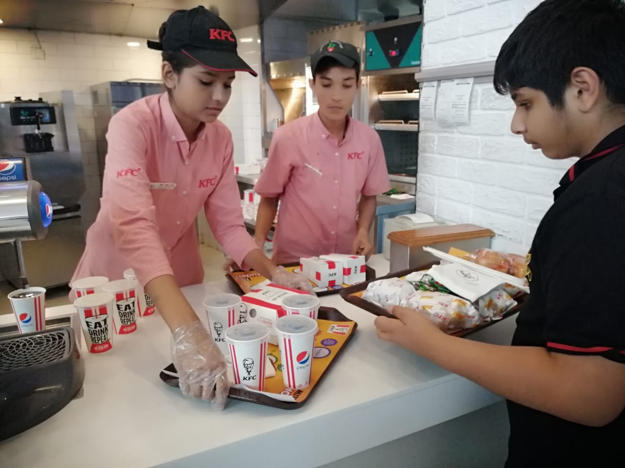 Women staff members at Pakistan’s first all-women run eatery, a fast-food joint in Lahore, deliver orders to waiting customers. August 1, 2019. (AN Photo)