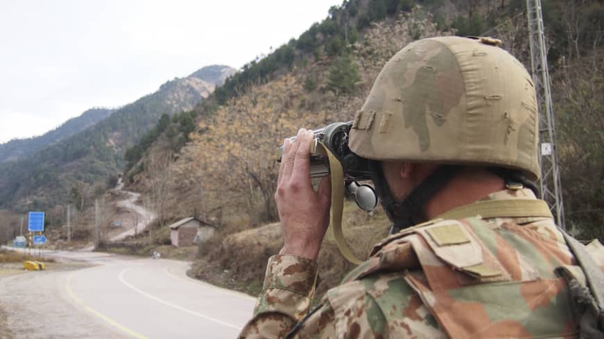 A Pakistani soldier watches the movement of Indian forces along the Line of Control from a post in Chakoti, 50 kilometers from Muzaffarabad, the capital of Pakistani Kashmir on February 23, 2019. (AP/File)