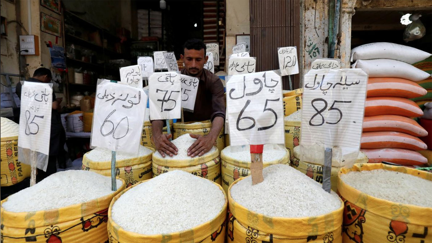 In this file photo, a vendor arranges different types of rice, with their prices displayed, at his shop in a wholesale market in Karachi, Pakistan April 2, 2019. (REUTERS)