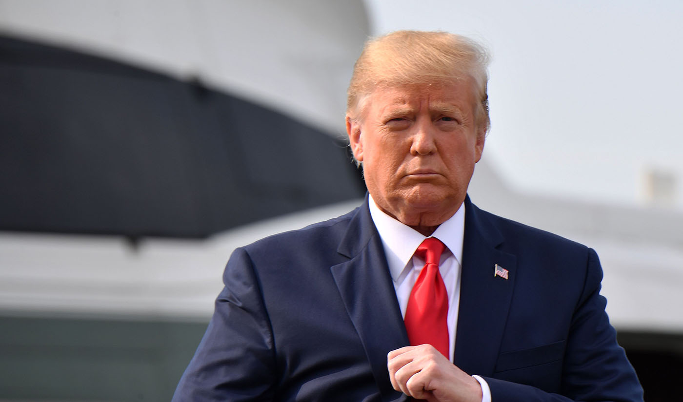 In this file photo, US President Donald Trump walks after stepping off Marine One upon arrival to Manchester, New Hampshire, on Aug. 15, 2019. (AFP)