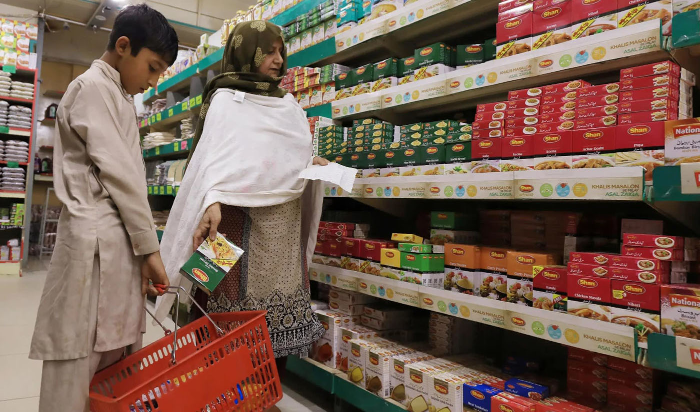 In this file photo, a woman shops for grocery items at a store in Peshawar, Pakistan April 3, 2019. (REUTERS)