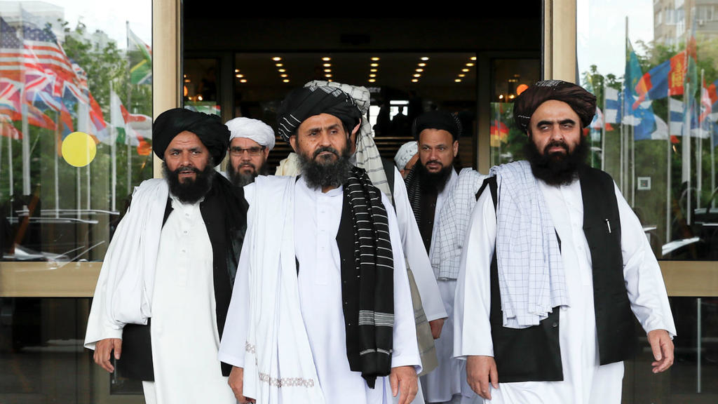 Members of a Taliban delegation, led by chief negotiator Mullah Abdul Ghani Baradar (C, front), leave after peace talks with Afghan senior politicians in Moscow, Russia May 30, 2019. (REUTERS)