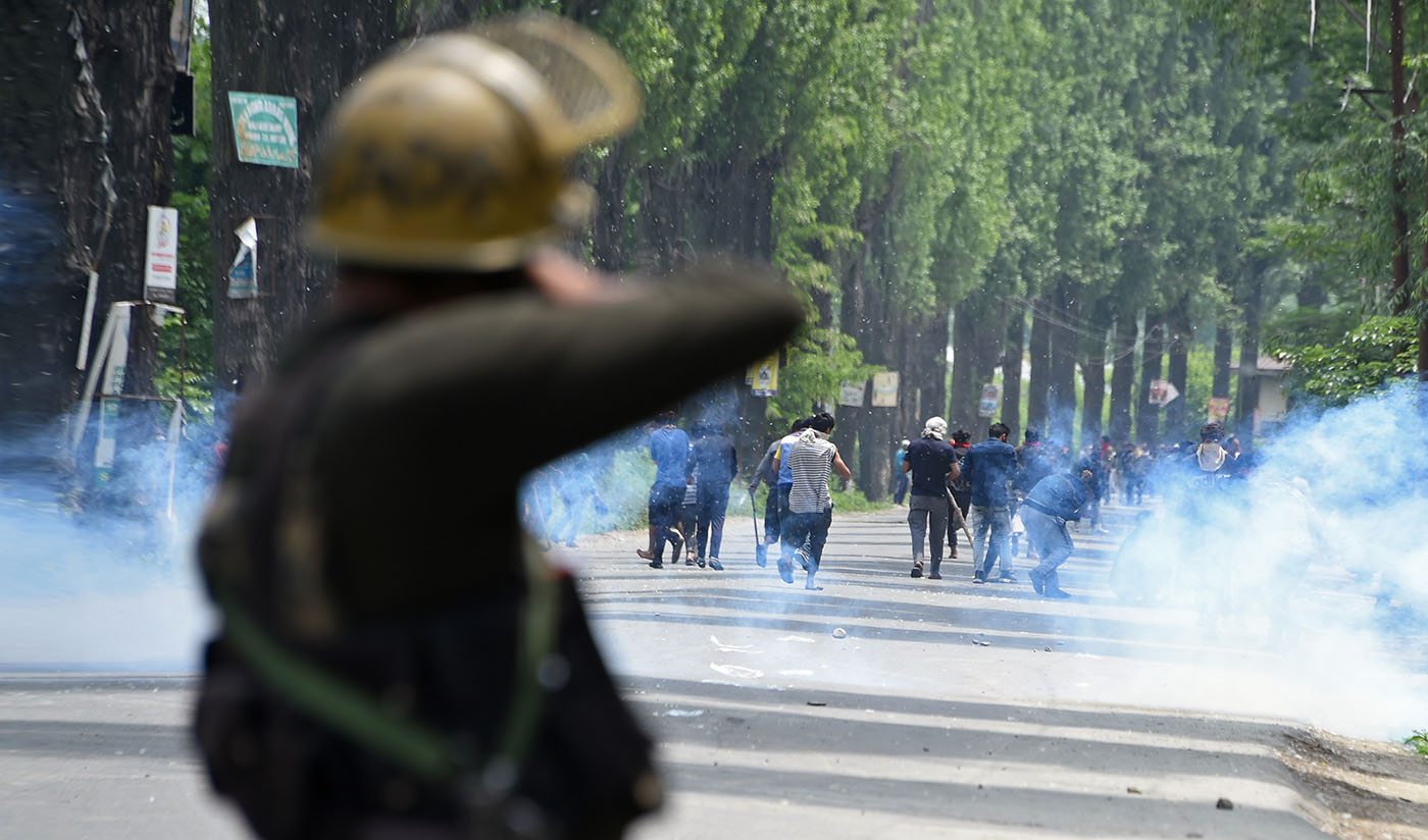 In this file photo, Indian police fire tear smoke shells towards Kashmiri protestors at Mirgund Pattan on the outskirts of Srinagar on May 13, 2019. (AFP)