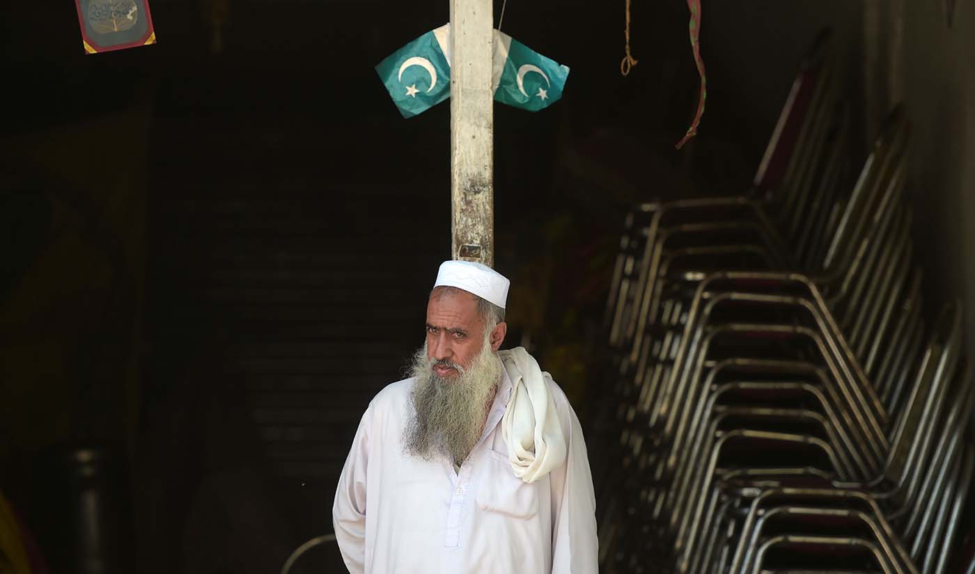 A Pakistani Kashmiri vendor looks on outside his shop at a market near the Line of Control (LoC) — the de facto border between Pakistan and India — in Chakothi sector, in Pakistan-administered Kashmir on Aug. 29, 2019. (AFP)