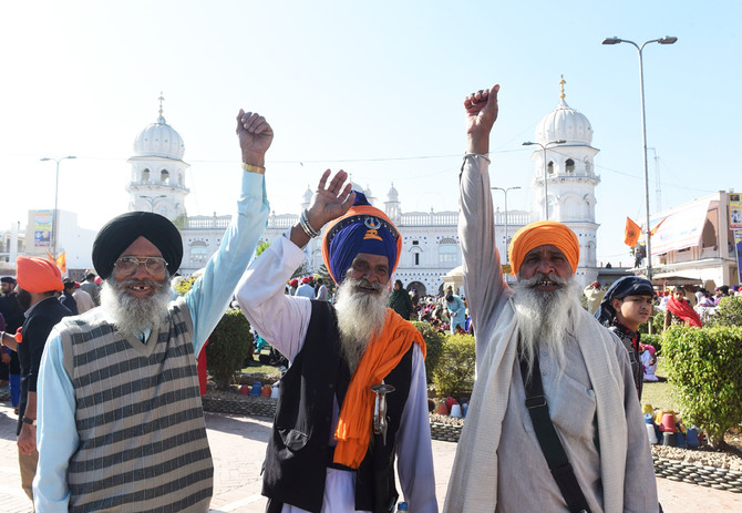Sikh pilgrims shout slogans on the occasion of the 550th birth anniversary of Guru Nanak Dev Ji in Nankana Sahib, a district in the Punjab province of Pakistan on November 23, 2018. (AFP)
