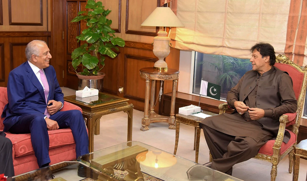 In this photo released by the Press Information Department, Pakistan’s Prime Minister Imran Khan, right, meets US envoy Zalmay Khalilzad in Islamabad, Pakistan, Thursday, Aug. 1, 2019. (Press Information Department, via AP)