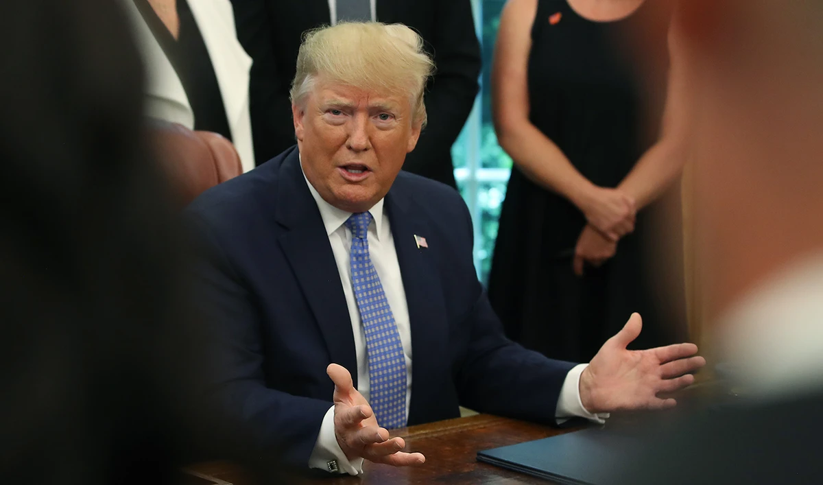 In this file photo, U.S. President Donald Trump speaks to reporters in the Oval Office at the White House in Washington, DC on June 25, 2019. (AFP)
