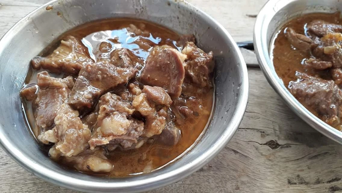 Specially cooked mutton is served in a bowl to guests on Eid day, August 12, 2019 in Dogar Umarzai, a town in northwestern Khyber Pakhtunkhwa (KP) province. The village is situated on the periphery of North Waziristan tribal district, which is known for its traditional food where people keep their doors open for all and serve them all sorts of delights on Eid day.