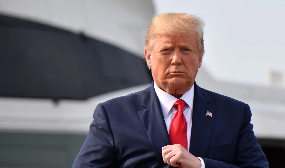 In this file photo, US President Donald Trump walks after stepping off Marine One upon arrival to Manchester, New Hampshire, on Aug. 15, 2019. (AFP)