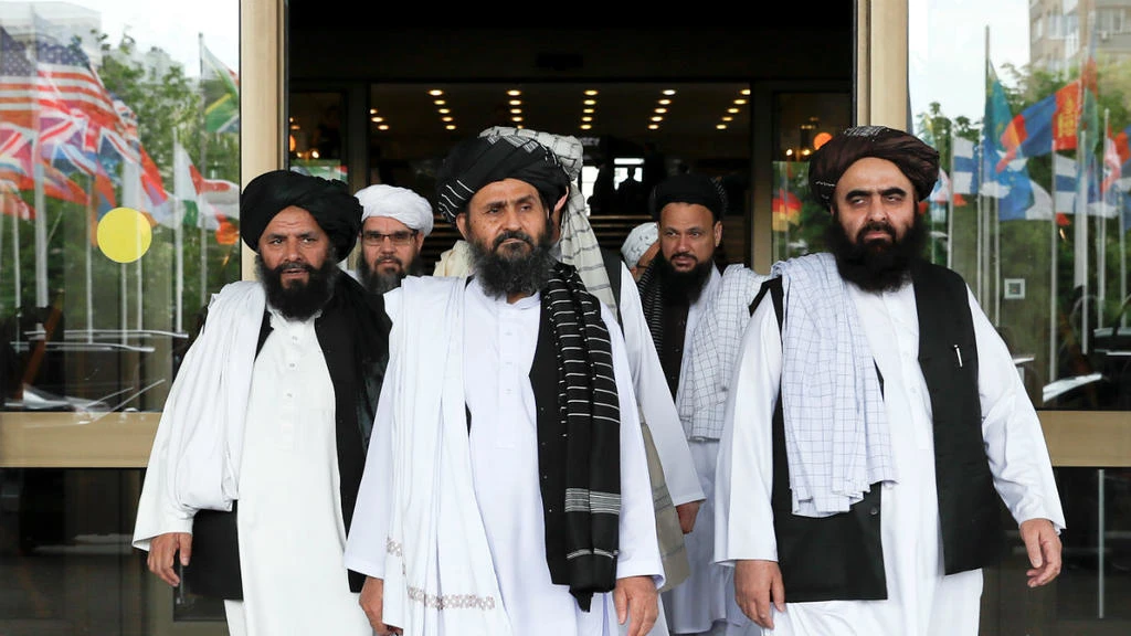 Members of a Taliban delegation, led by chief negotiator Mullah Abdul Ghani Baradar (C, front), leave after peace talks with Afghan senior politicians in Moscow, Russia May 30, 2019. (REUTERS)