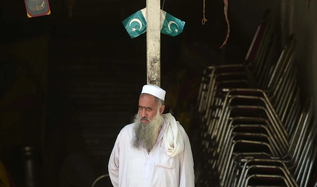 A Pakistani Kashmiri vendor looks on outside his shop at a market near the Line of Control (LoC) — the de facto border between Pakistan and India — in Chakothi sector, in Pakistan-administered Kashmir on Aug. 29, 2019. (AFP)