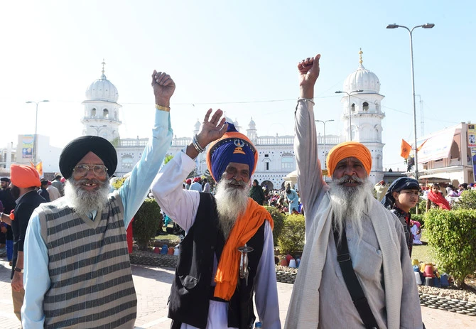 Sikh pilgrims shout slogans on the occasion of the 550th birth anniversary of Guru Nanak Dev Ji in Nankana Sahib, a district in the Punjab province of Pakistan on November 23, 2018. (AFP)
