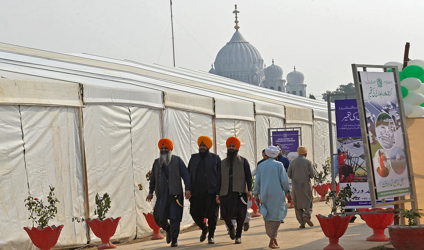 In this file photo, Pakistani Sikhs walk before a groundbreaking ceremony for the Kartarpur Corridor to be set up between India and Pakistan in Kartarpur on Nov. 28, 2018. (AFP)