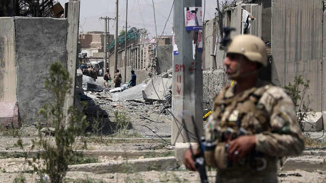 An Afghan security personnel stands guard at the site where a Taliban car bomb detonated at the entrance of a police station in Kabul on Aug. 7, 2019. (AFP/File)