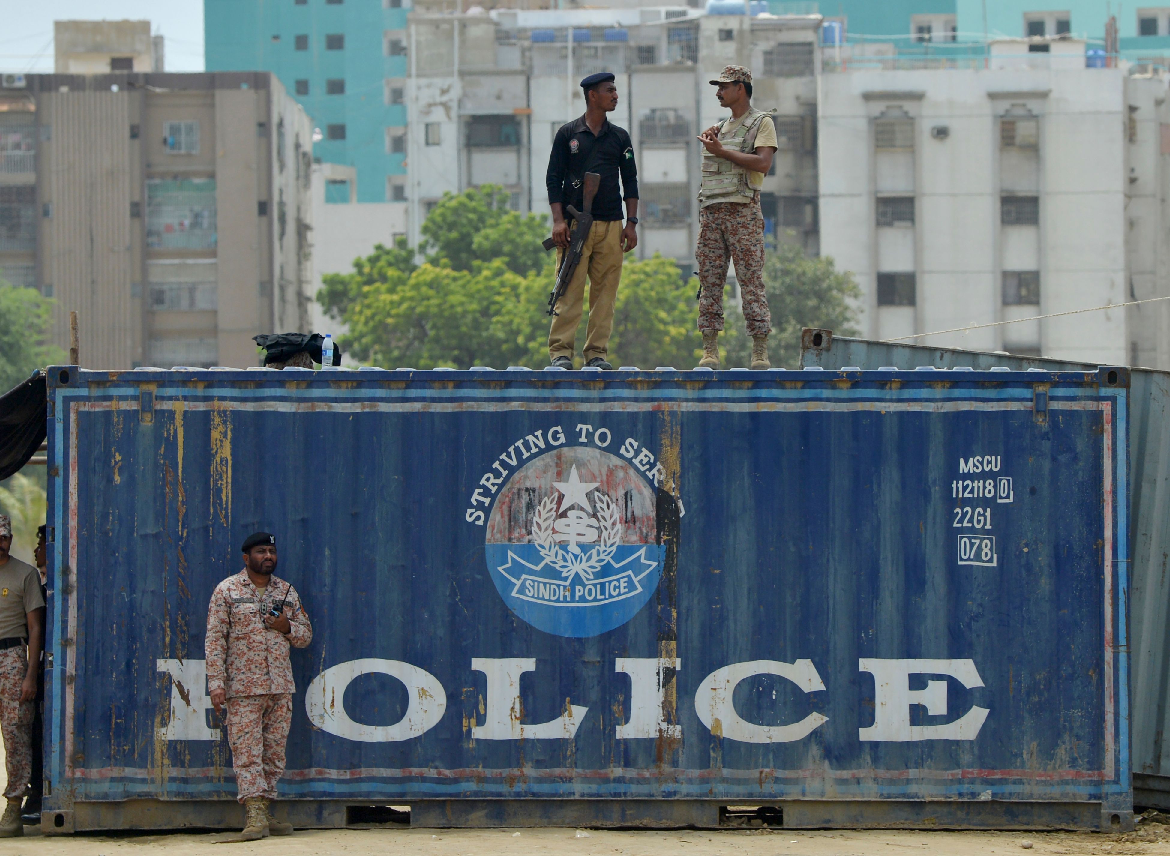Pakistani security personnel cordon the area during the Shiite Muslim religious procession on the first Muslim month of Muharram in Karachi on September 8, 2019. Ashura is one of the most important festivals for Shiite Muslims, and falls on the 10th day of Muharram, which is the mourning period for the seventh-century killing of Imam Hussein, the grandson of the Prophet Muhammad. (AFP)