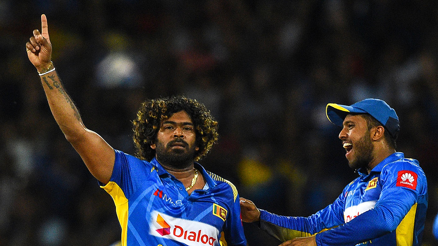 Sri Lankan cricketer Lasith Malinga, left, celebrates with teammates after dismissing Bangladesh captain Tamim Iqbal during the first One Day International (ODI) cricket match between Sri Lanka and Bangladesh at the R.Premadasa Stadium in Colombo on July 26, 2019. (AFP)