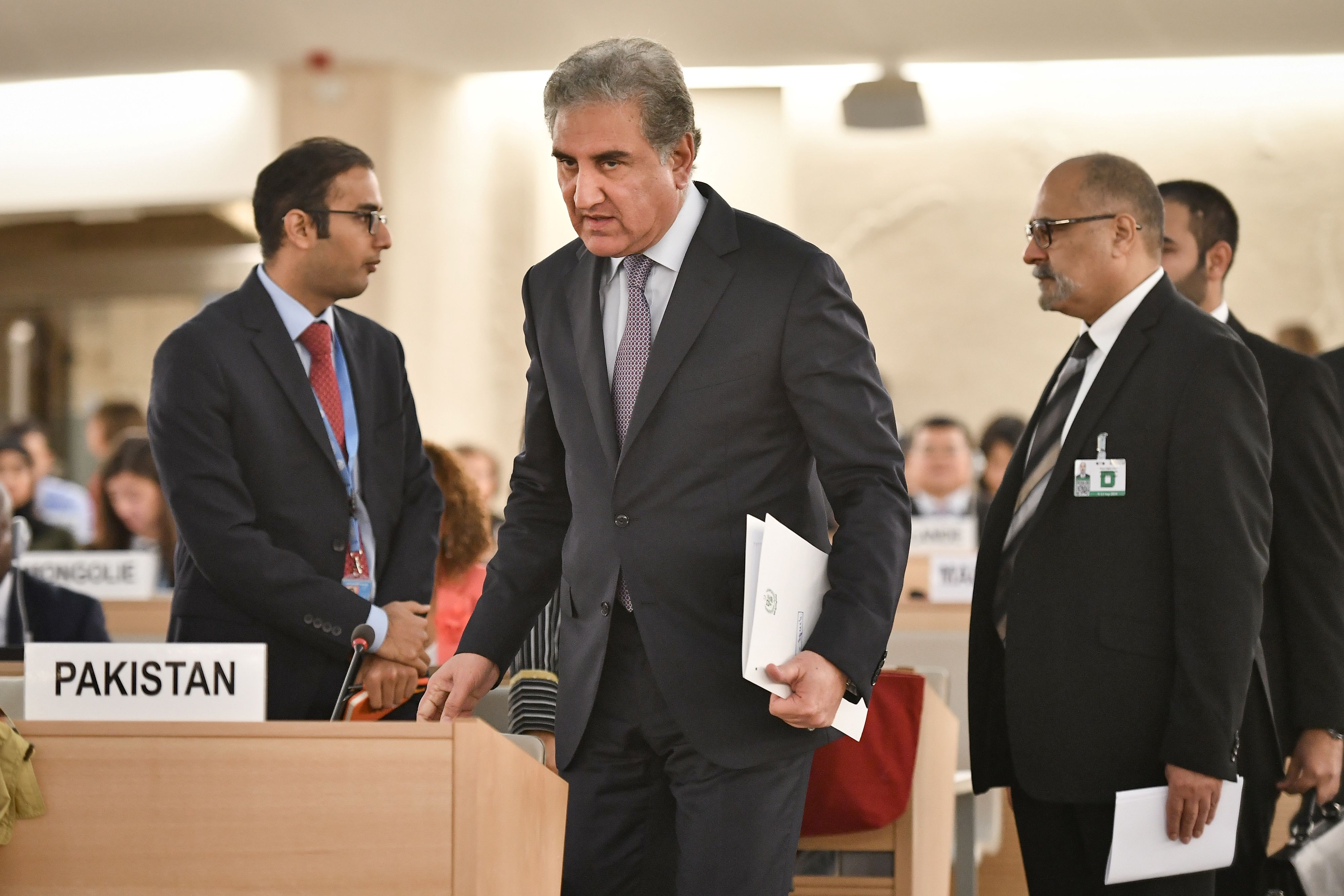 Pakistani Foreign Minister Shah Mehmood Qureshi (C) arrives to address the United Nations Human Rights Council on September 10, 2019 in Geneva. (AFP)