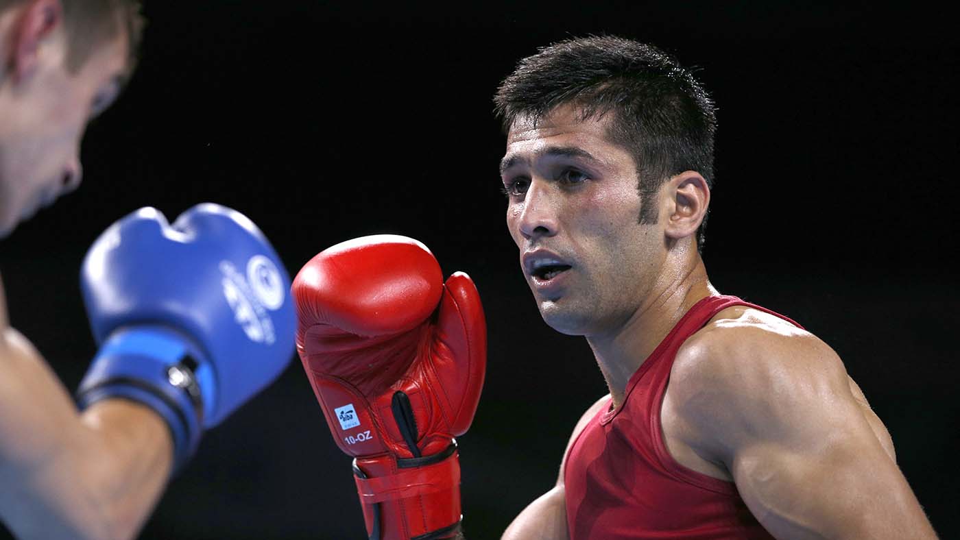 Pakistan’s Muhammad Waseem (red) fights Australia’s Andrew Moloney during the men’s fly (52kg) final boxing bout at the 2014 Commonwealth Games in Glasgow, Scotland, on Aug. 2, 2014. (AFP/File)