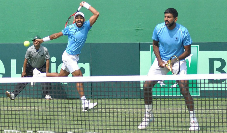 Indian doubles pair of Rohan Bopanna and Divij Sharan in action against Italy's Matteo Berrettini and Simone Bolelli at the Davis Cup World Group doubles rubber in Kolkata on Feb. 2, 2019. (Photo courtesy : Kuntal Chakrabarty/IANS)