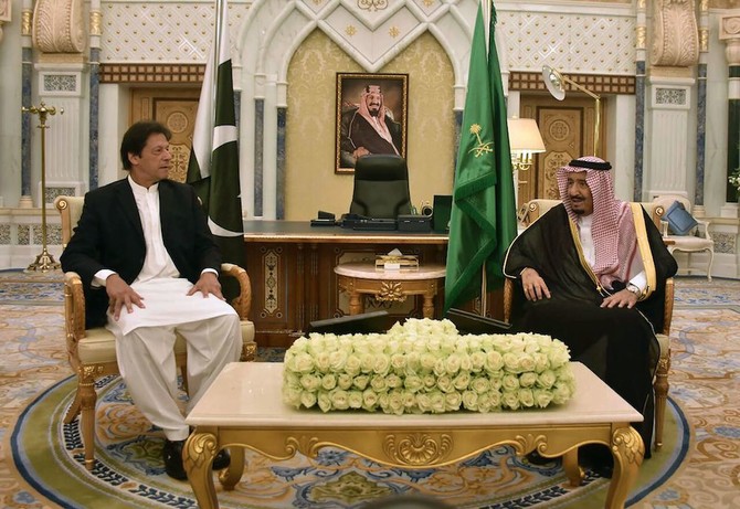 In this handout photograph released by Pakistan’s Press Information Department (PID) on October 23, 2018, Saudi King Salman meets with Pakistan’s Prime Minister Imran Khan during a meeting in Riyadh. Saudi Arabia. (AFP)