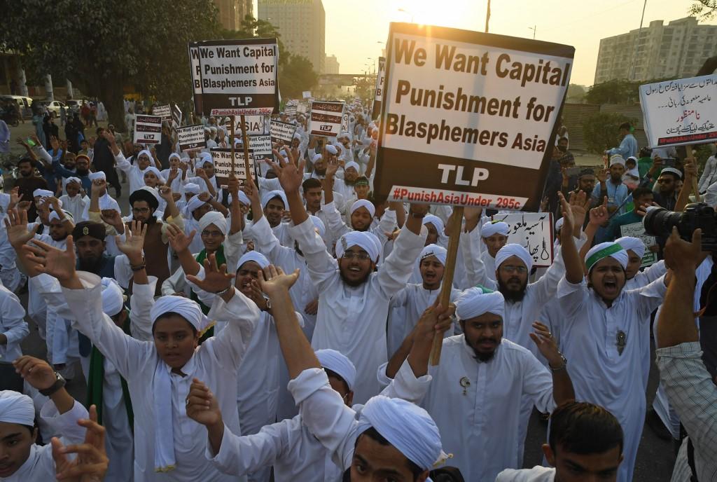 Blasphemy law is often exploited by religious hard-liners as well as ordinary Pakistanis to settle scores. Above, activists carry placards against Asia Bibi, a Pakistani Christian woman who was released after spending eight years on death row for blasphemy, in Karachi on November 21, 2018. (AFP file)