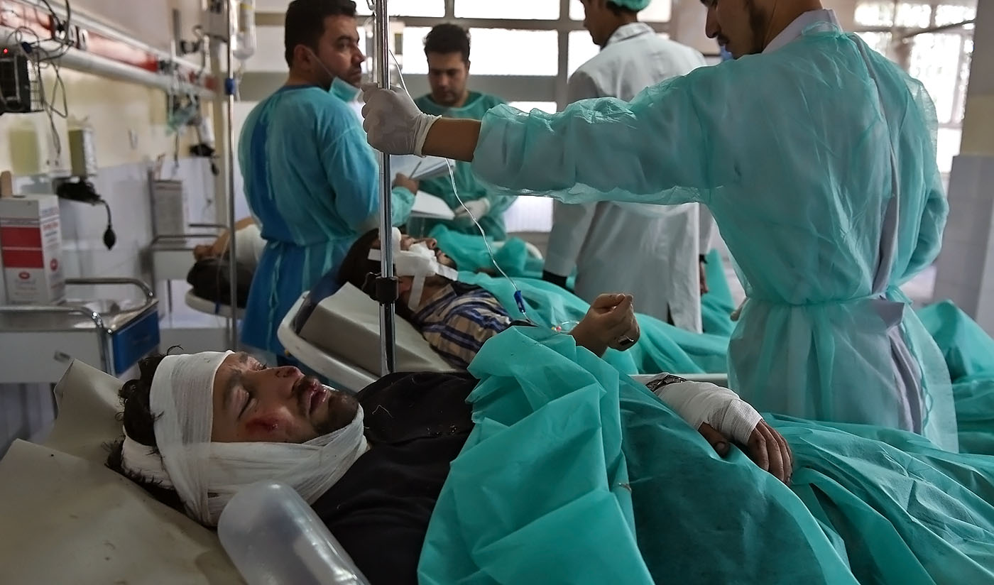 Wounded Afghan men receive treatment at the Wazir Akbar Khan hospital following a blast in Kabul on Sept. 17, 2019. (AFP)