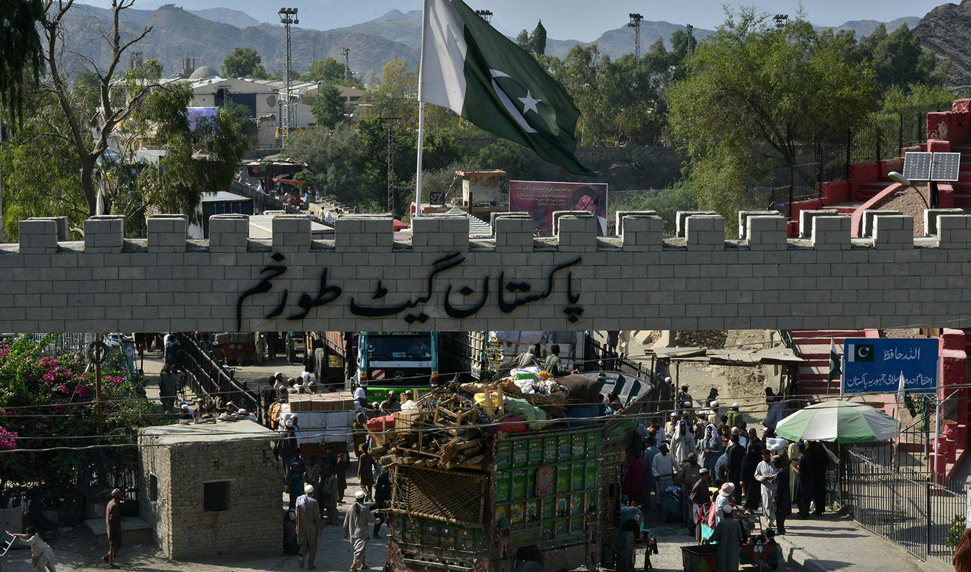 In this photograph taken on September 7, 2016, a truck carrying the belongings of a repatriated Afghan refugee family crosses the border into Afghanistan at the Torkham crossing point in Pakistan’s tribal Khyber district. (AFP/File)