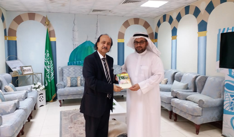 In this undated photo, Dr. Khalid Abbas Asadi presents his book 'Pak-Saudi Friendship' to an educationist, Dr Abdul Hamid Al-Jahni, at the Ministry of Education, Madinah. (Photo Courtesy: Dr. Asadi)